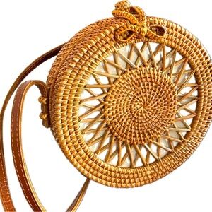 Handwoven Artisan Rattan crossbody bag, canvas lining, leather strap.